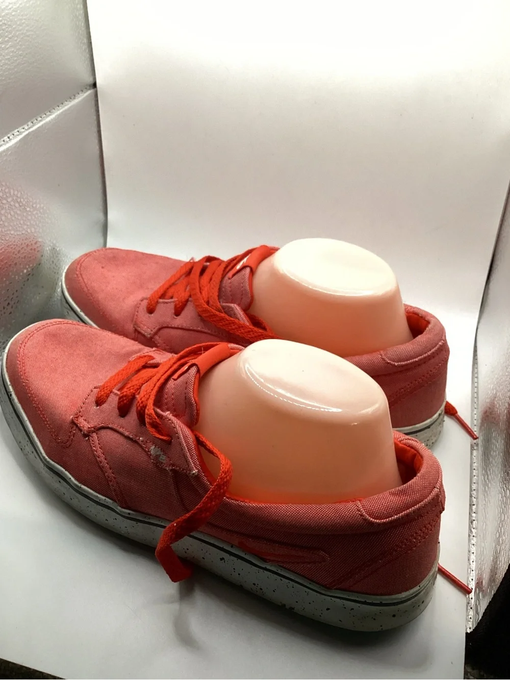 Nike 6.0 skate shoes featuring a vibrant red canvas upper and a speckled midsole